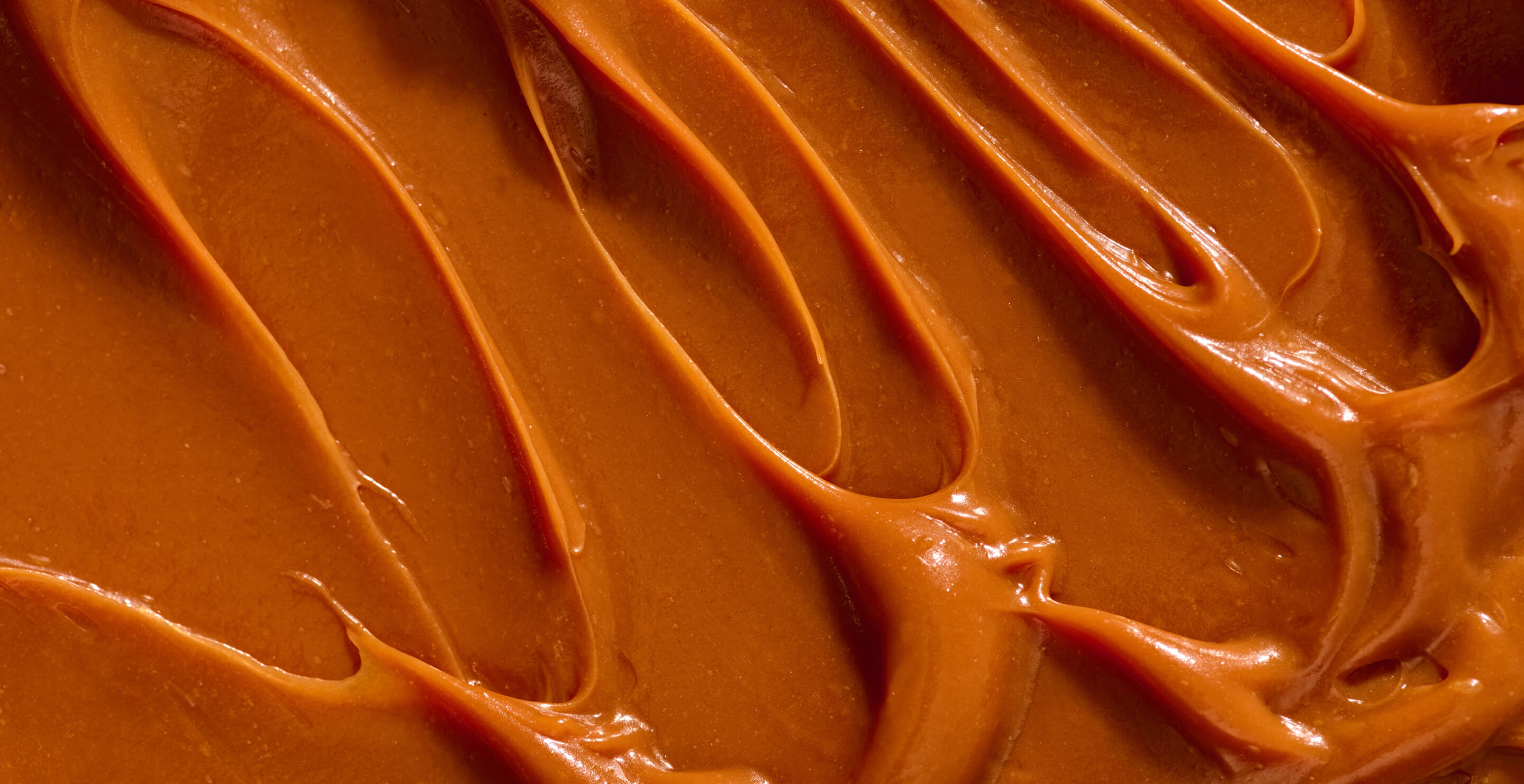 Close-up of smooth, brown peanut butter